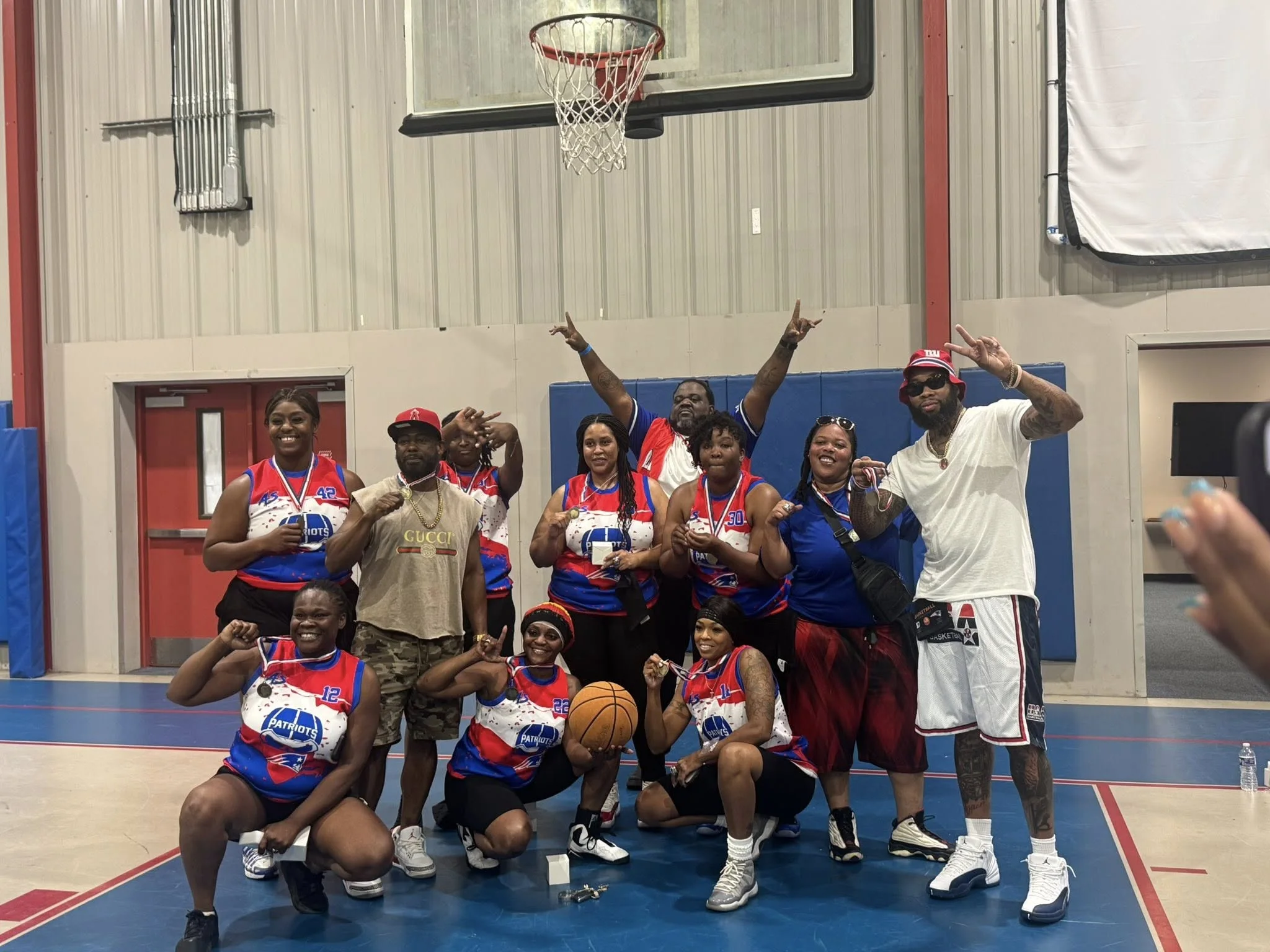 Community basketball players gathered together on the activity center court