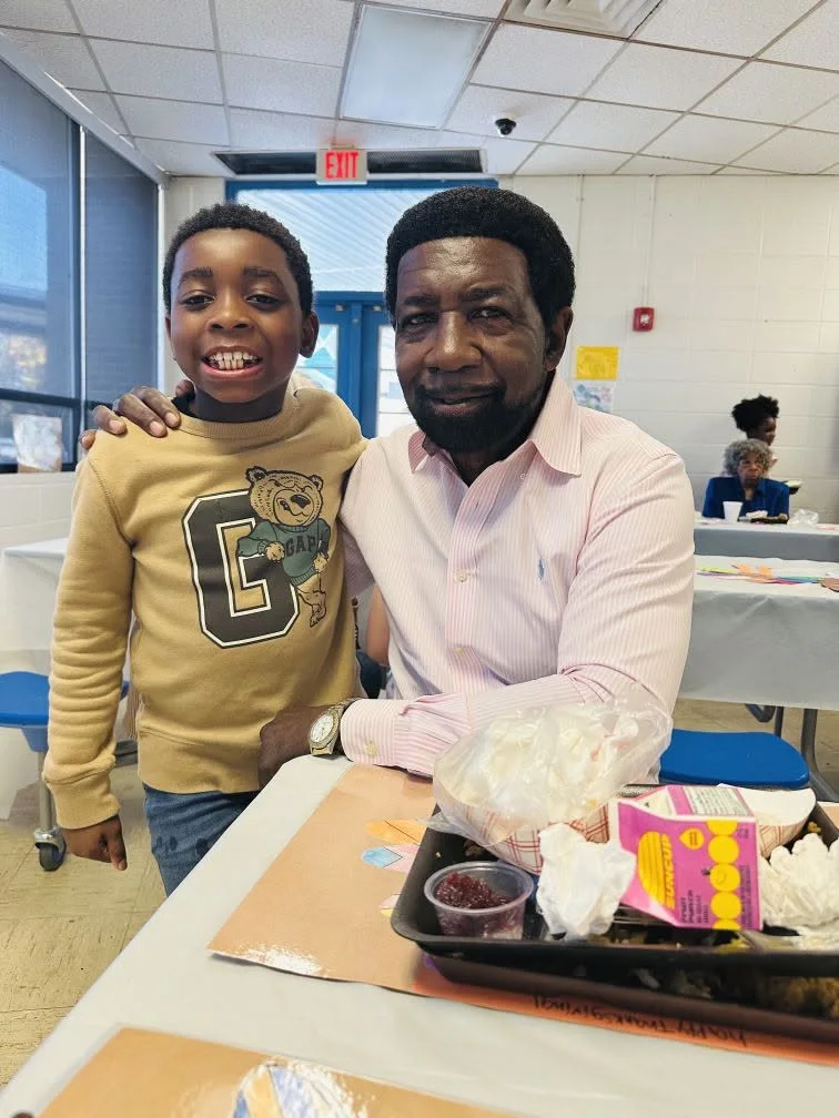 Director Edward Ward with a young community member inside the center
