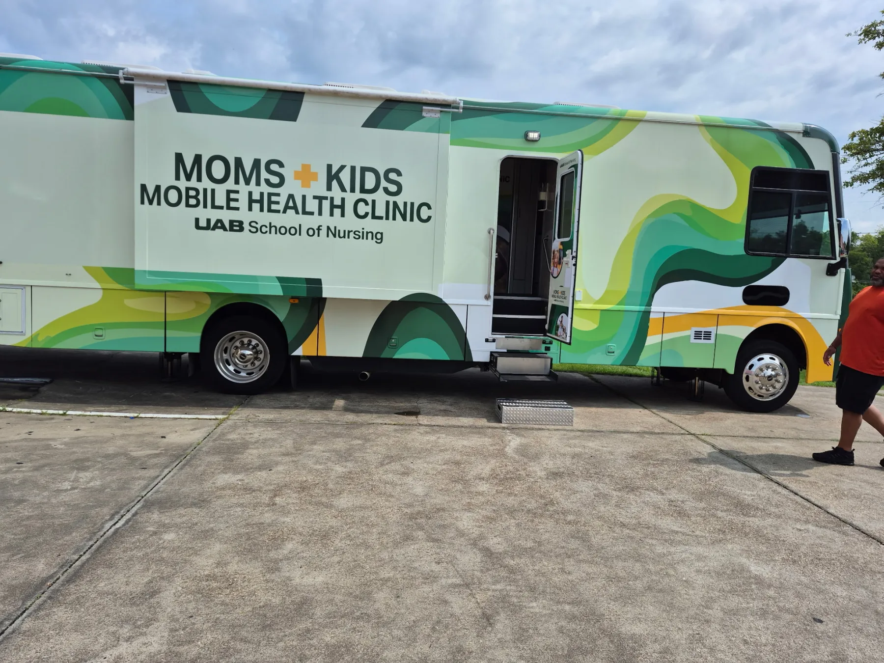 The UAB Moms and Kids Mobile Health Clinic parked outside the center