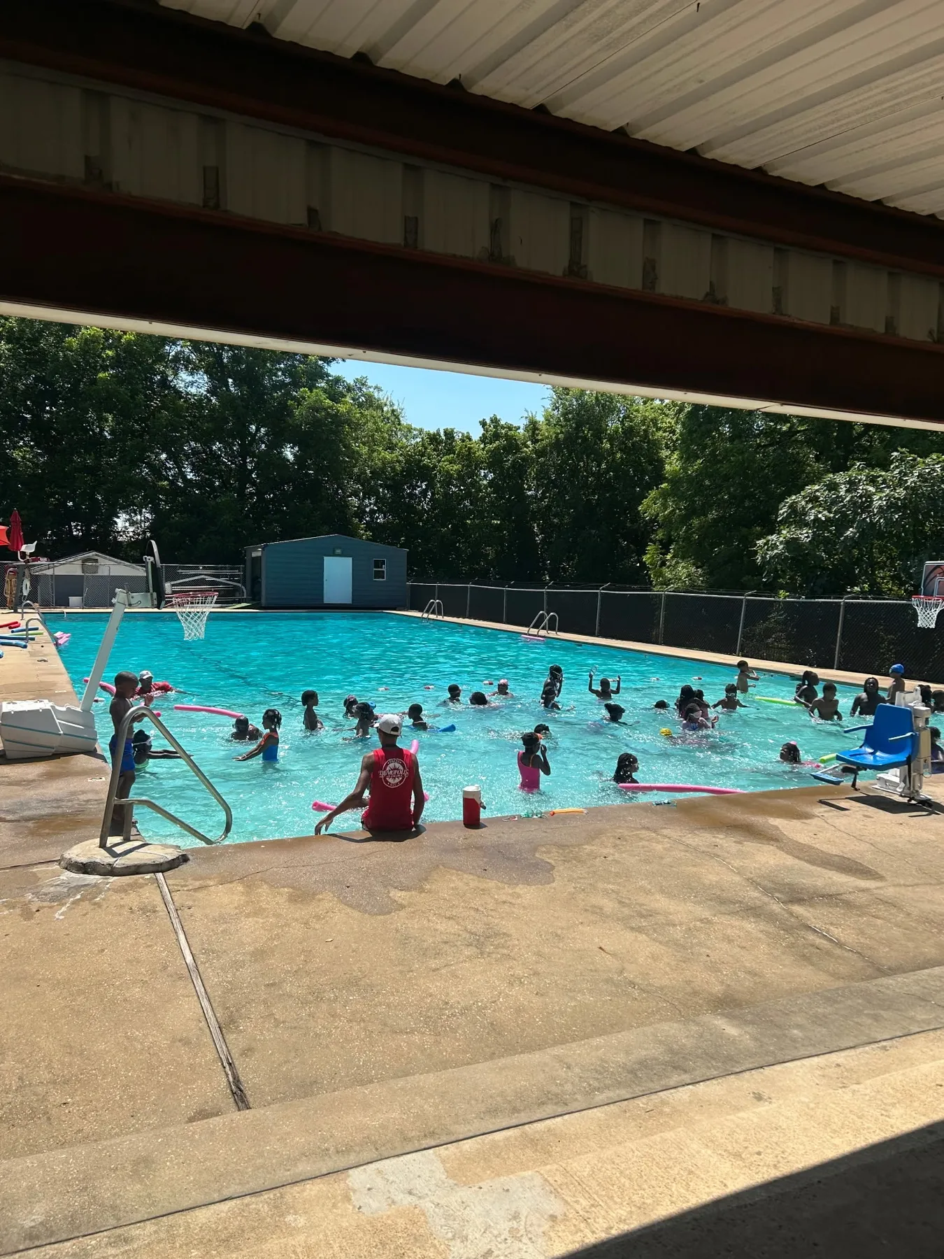 Children and lifeguards during a general swimming session at the pool