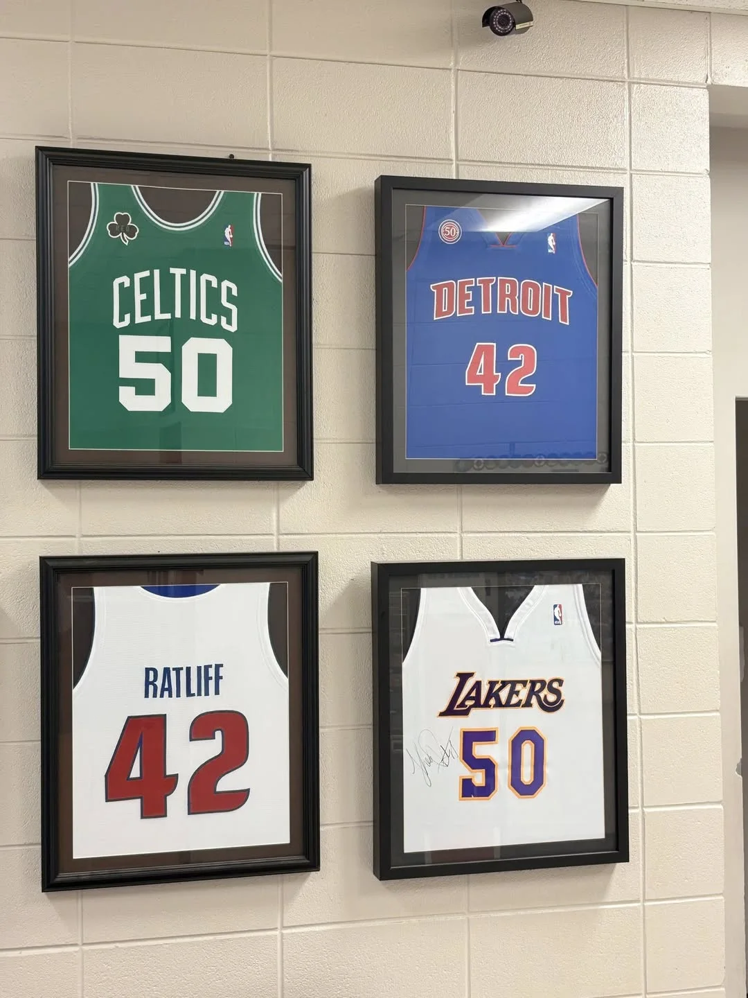 Framed Theo Ratliff jerseys displayed inside the activity center